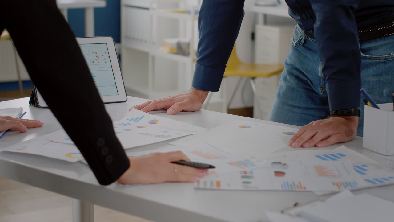 Close up of analysis documents with data charts on desk