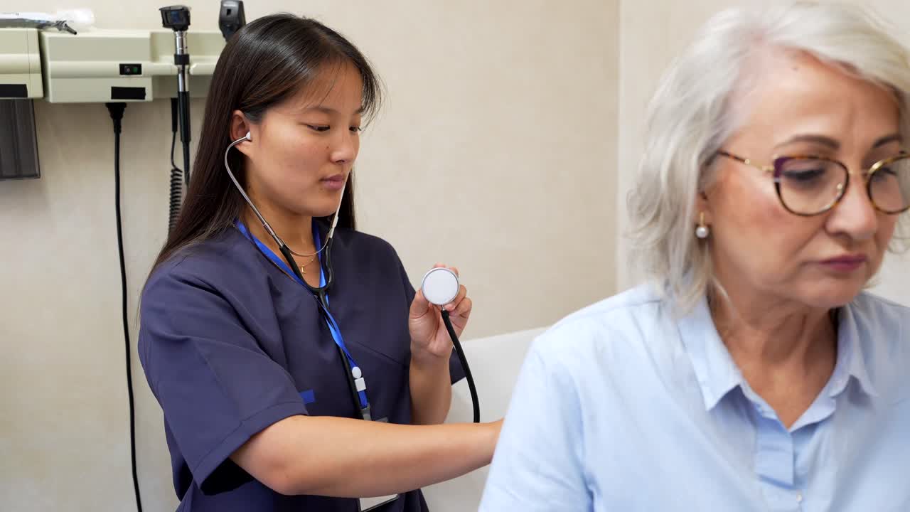 Doctor Examining Senior Woman with Stethoscope