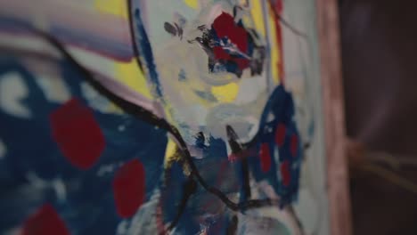 In-this-captivating-slow-motion-detail-shot-of-an-art-picture-canvas,-revealing-the-intricate-texture-and-nuanced-brush-strokes-that-make-up-the-painting's-essence-with-blending-colours