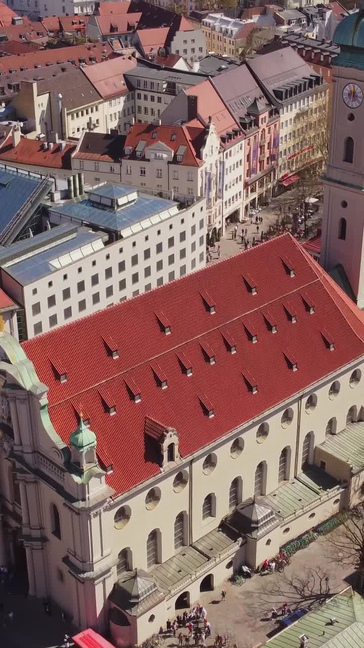 Munich's marienplatz, showcasing rooftops, Heilig Geist church, and city vibe, aerial view, vertical