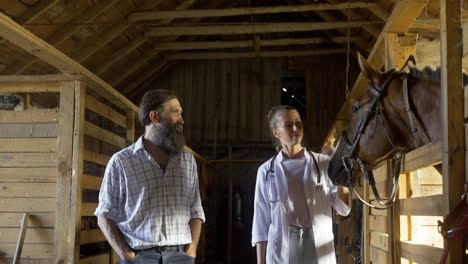 people talking at the stables