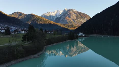 aeria view snowy high mountains with sunset in autumn