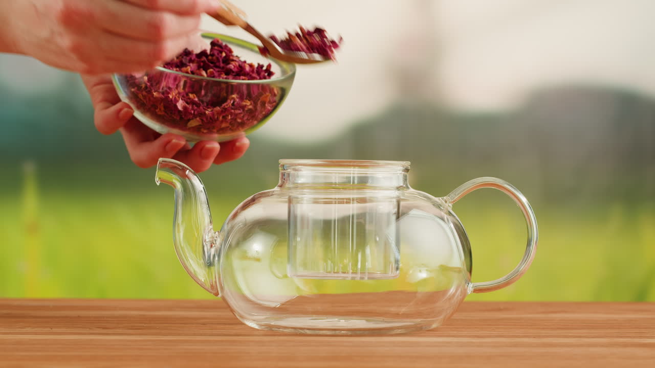 Preparing Rose Petal Tea in a Glass Teapot