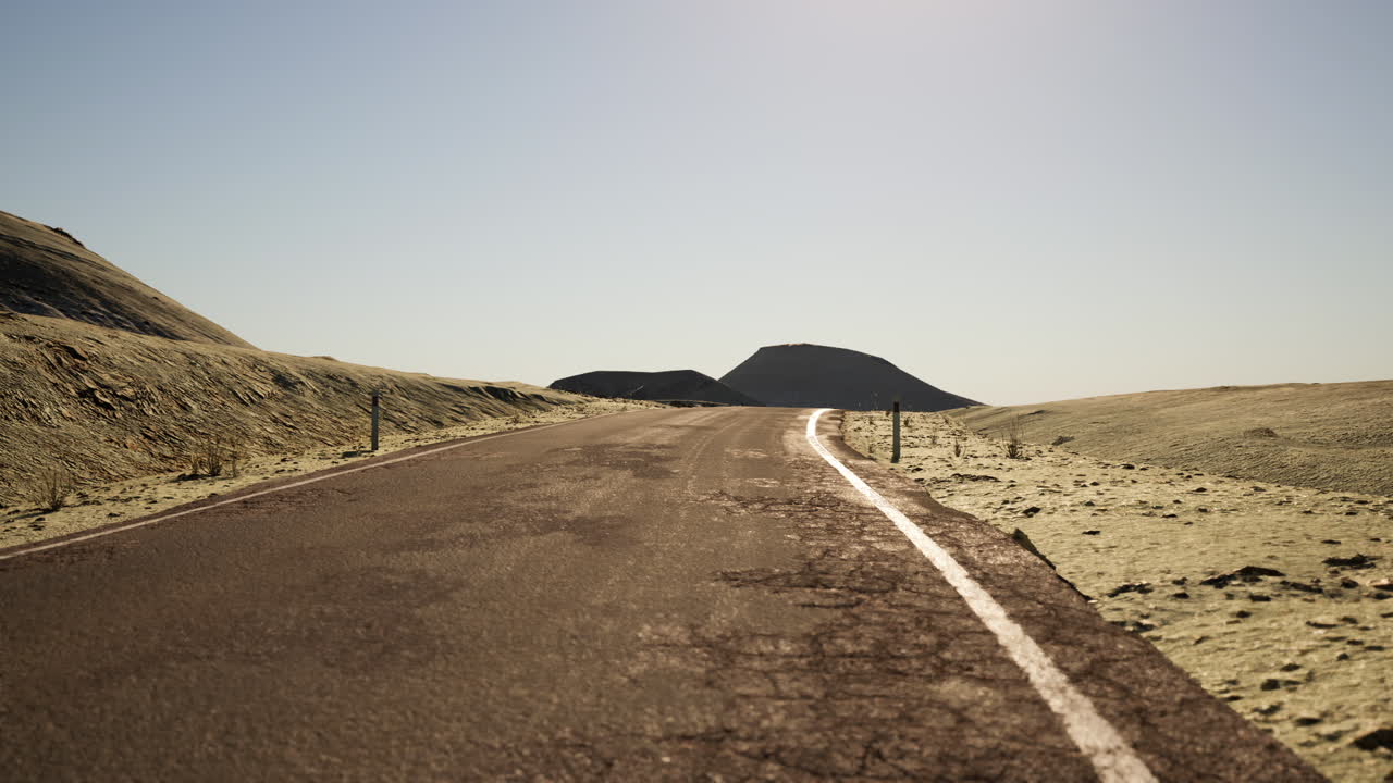 Winding road through the expansive landscape of mongolia during daytime