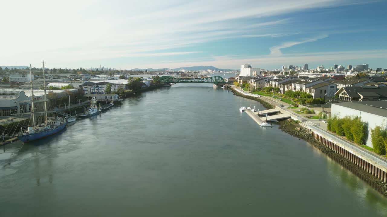The Tidal Canal reflects the soft hues of the sky as the Park Street Bridge stands as a vital connection over the water.