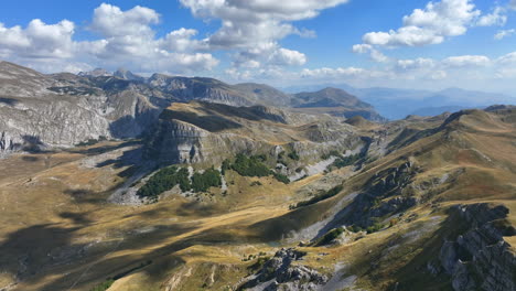 flight over beautiful mountain peaks covered with grass