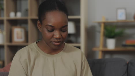 woman looking at a negative pregnancy test