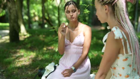 two women having a picnic in the park