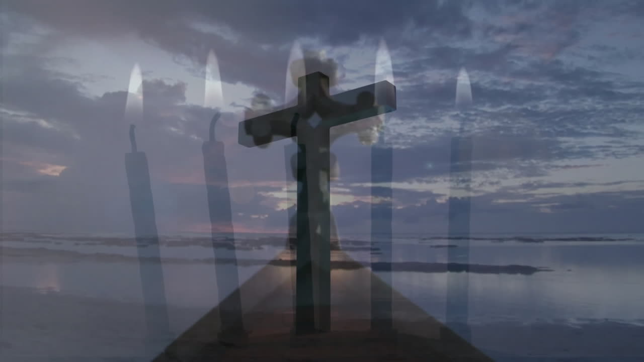 Layering dark wooden cross on pier over ocean at sunset, overlaying floating candle flames