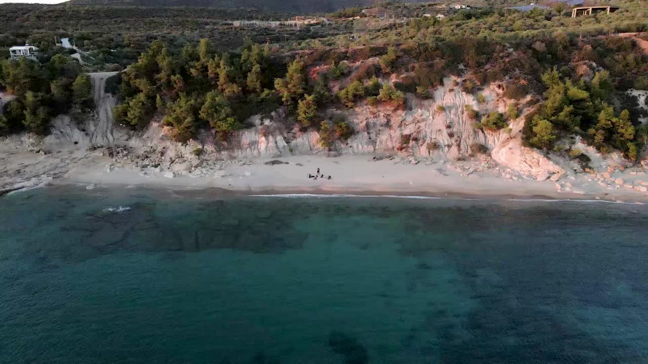People Relaxing On White Sand Beach On Aegean Sea Coast In Greece
