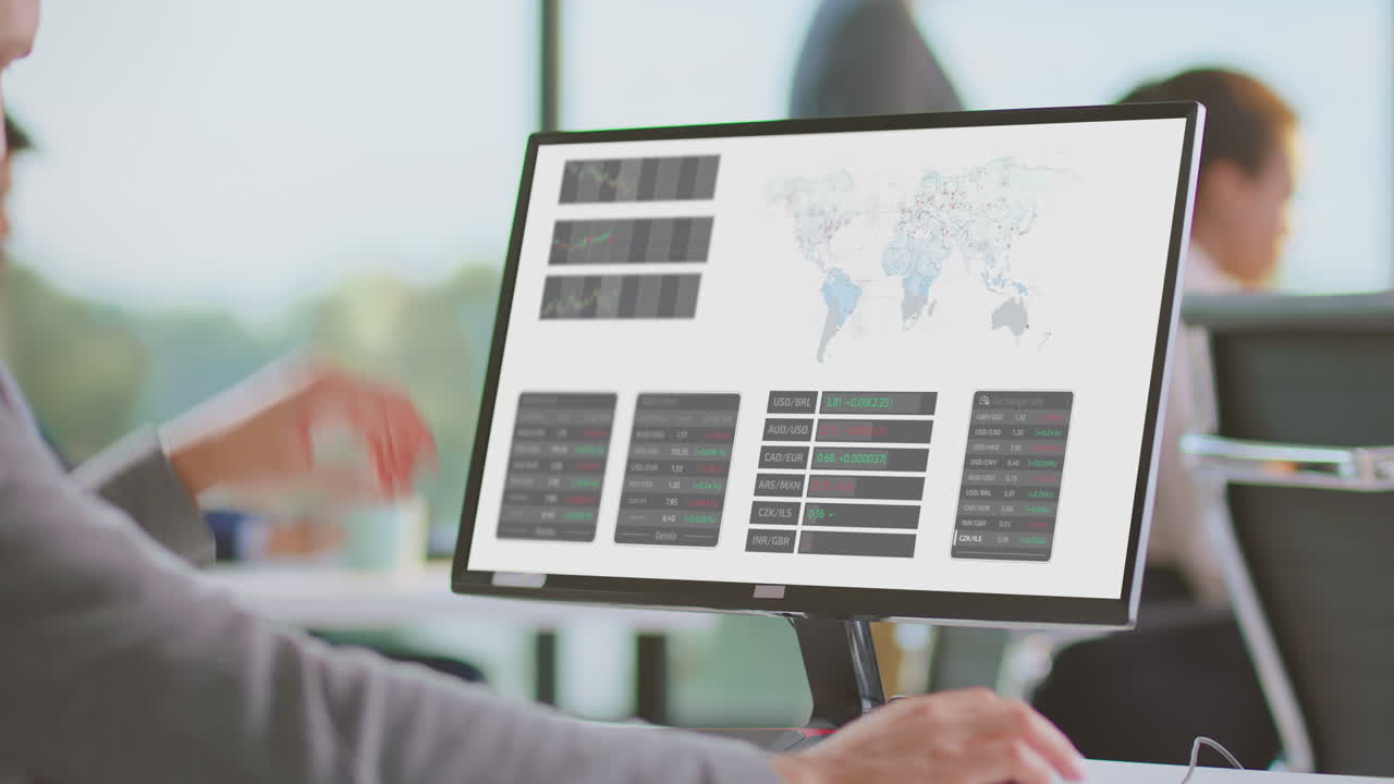Business Person Working on Computer with Financial Data