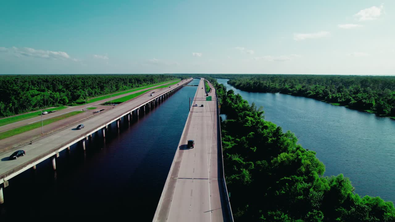 Long-span highway over Louisiana wetlands demonstrates engineered adaptation to rising waters, flood risk, and coastal resilience
