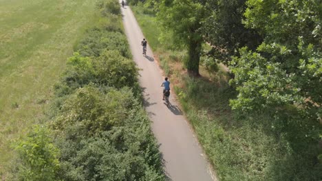 two cyclists travelling in nature