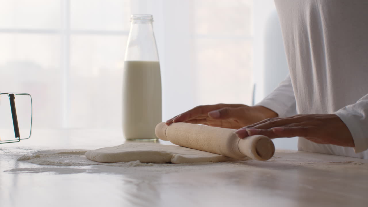 Woman rolling dough