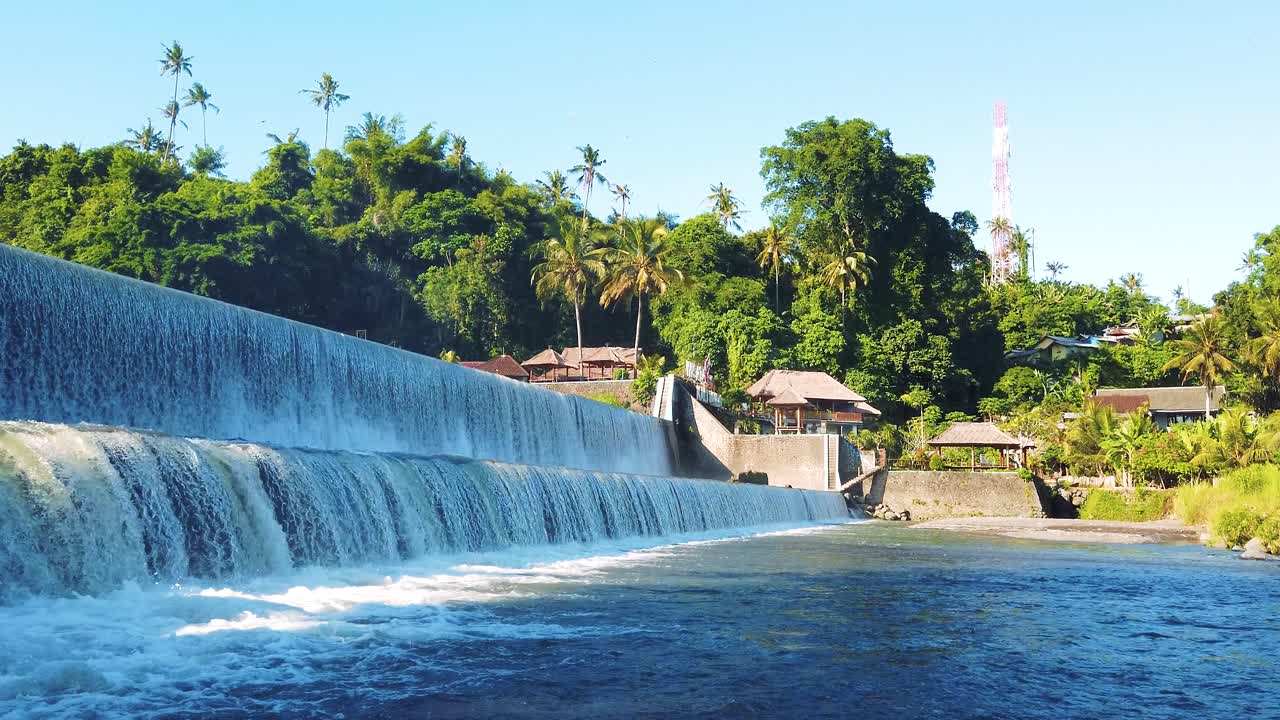 Panoramic DAM waterfall landscape at Klungkung, Bali, Indonesia, tropical greenery, skyline background, water falling slow