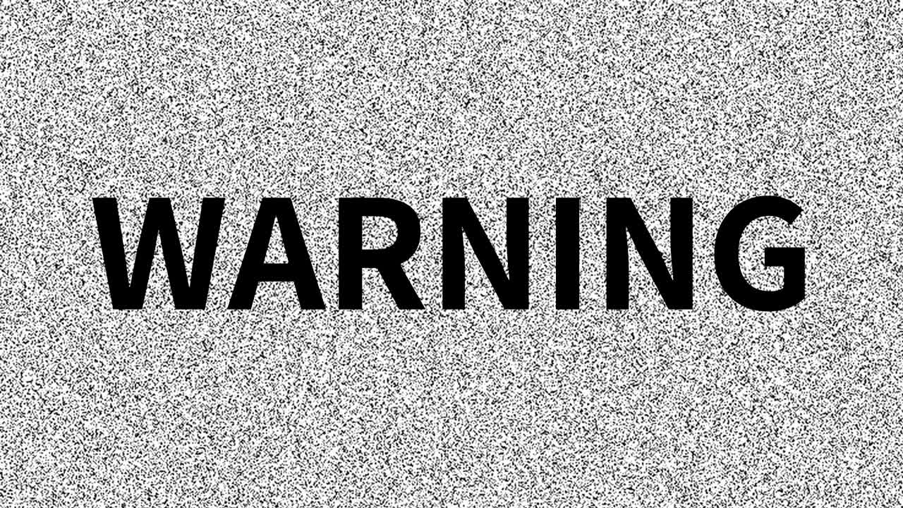 Warning. Word about problem on noisy old screen. Looping VHS interference. Vintage animated background, video footage