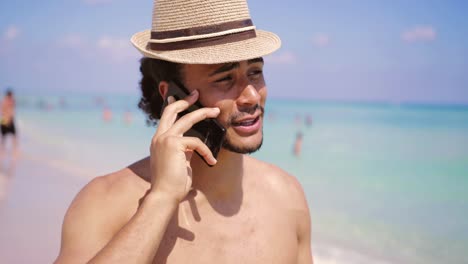 Cheerful-man-standing-with-smartphone