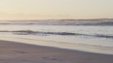 sea with waves and blue sky on sunny beach