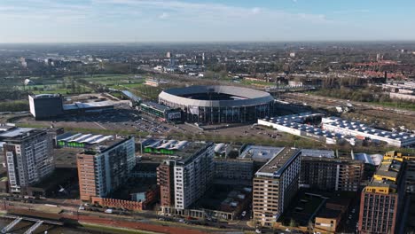 aerial view of a city with a stadium