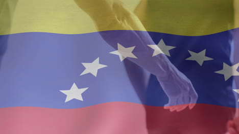 animation of flag of venezuela over diverse male athletes