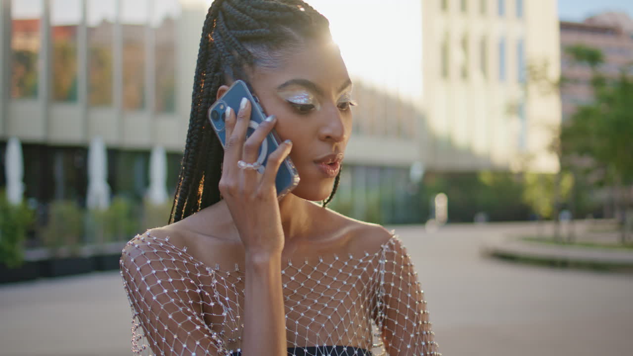 Fashion tourist lady calling phone at sunny neighbourhood closeup. Woman talking