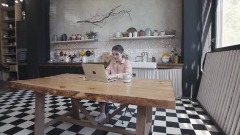 woman working from home kitchen