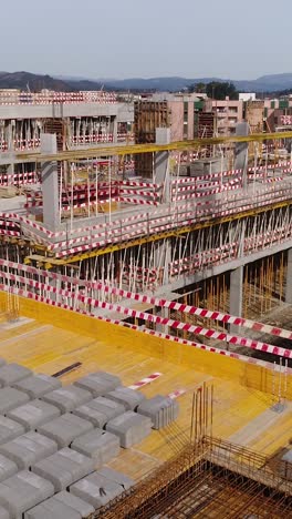 aerial building construction vertical video
