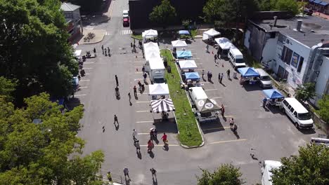 aerial view of a farmers' market in the middle of the day