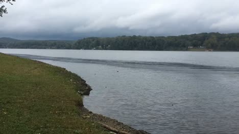 Time-Lapse-video-of-a-scenic-lake-with-a-storm-in-the-background-on-a-windy-day