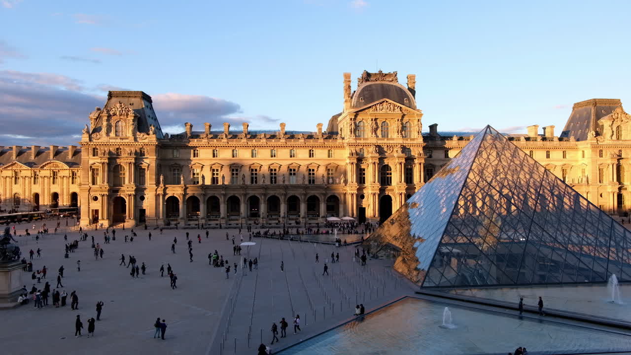 Paris, France - November 21, 2021: Front view of the Louvre Museum at sunset