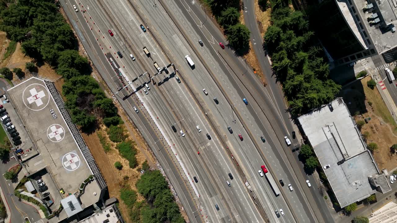 Top down drone shot of cars traveling on Interstate 5, through Seattle's downtown area