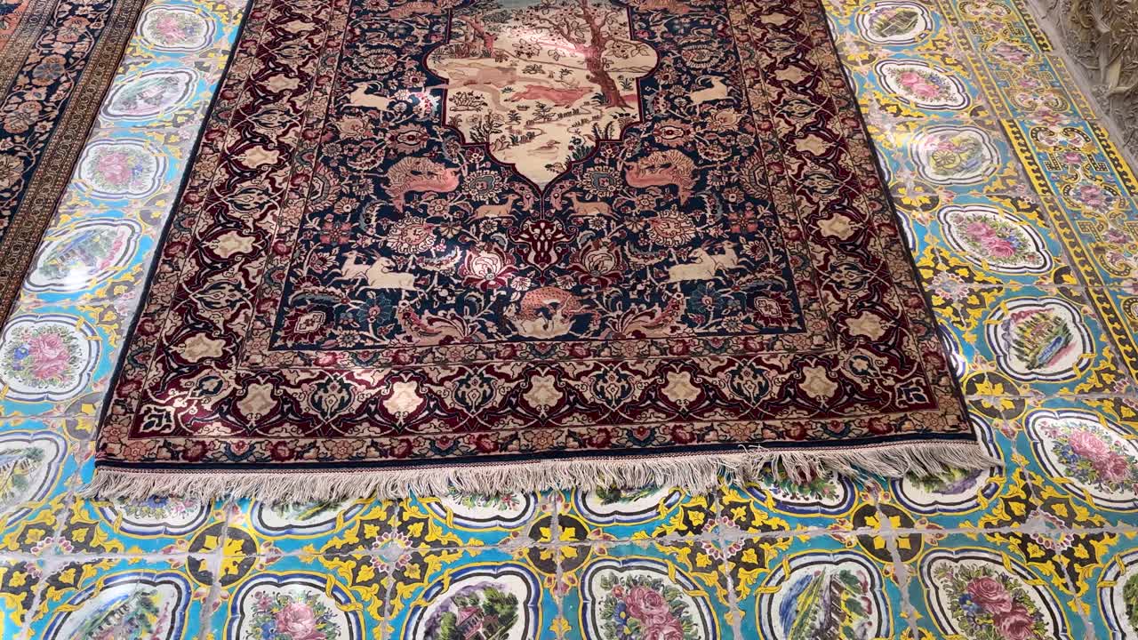wonderful Persian carpet with colorful vivid mosaic design the handmade texture of silk oriental pattern bazaar Shiraz Samarkand traditional craft textile industry tourism cultural heritage workshop