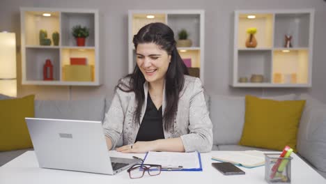 home office worker woman fun working on laptop, using it.