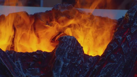 artificial safe fireplace close-up. flame of the fire of an artificial fireplace. electric fireplace