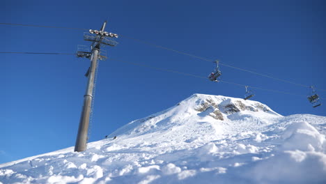 ski area in the swiss alps with people and chairlifts in the winter ski area of beckenried