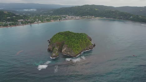 far shot of cabaret island and town in background