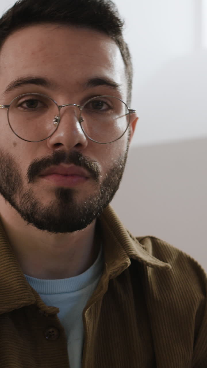 Portrait of a man with glasses and beard