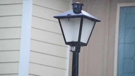 rain storm hitting street light