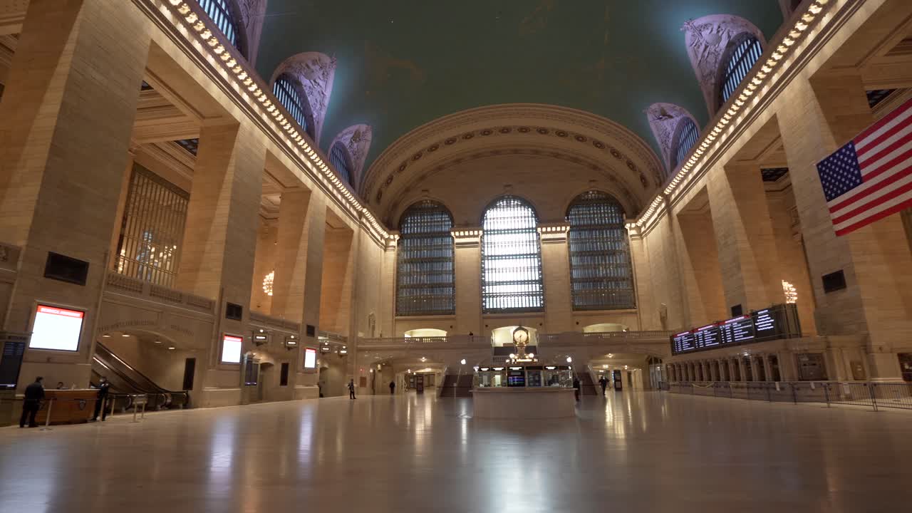 A wide-angle view of Grand Central Station in New York City empty with almost no people during the corona virus pandemic