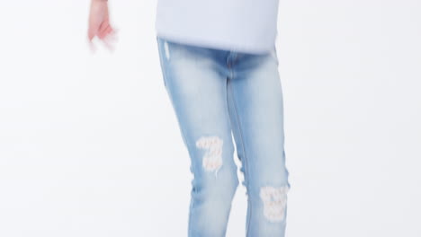 girl jumping against white studio background