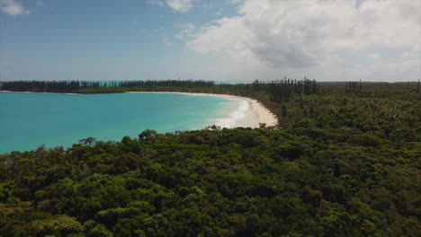 the isle of pines tropical paradise with a view of the beach and bay of rouleaux - aerial flyover