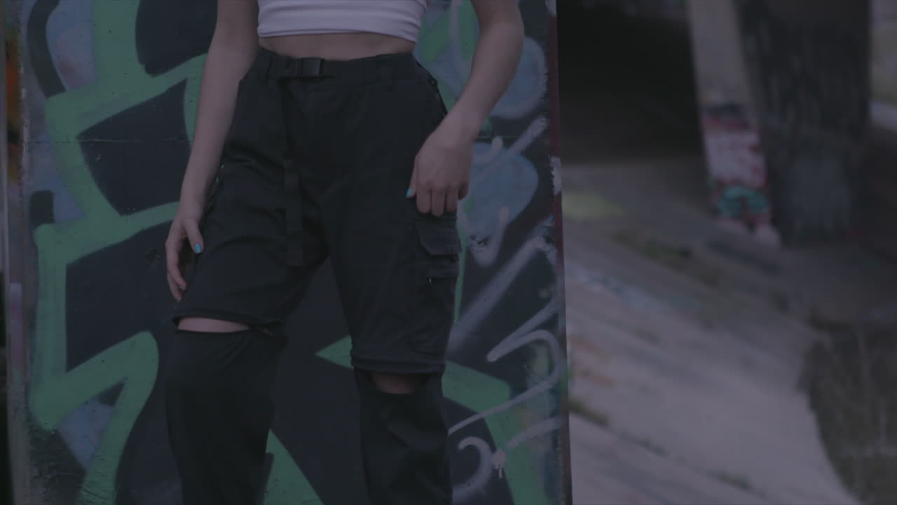 Modern girl wearing street cloths, wast down