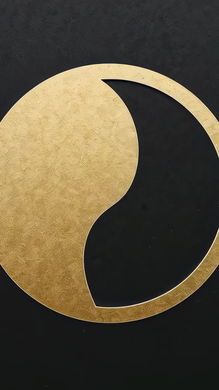Vertical video: Zooming camera filming gold emblem on textured backing highlighting hammered finish