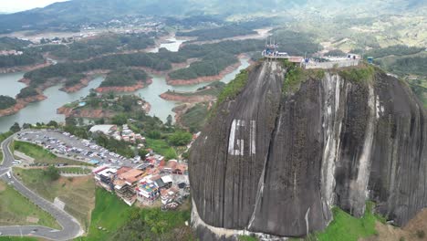 la piedra del penol in guatape medellin colombia in summer drone shot with town