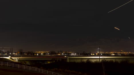 sunset to dark night with a highway and emergency response crew, mountains and lots of airplane light trails - long exposure time lapse
