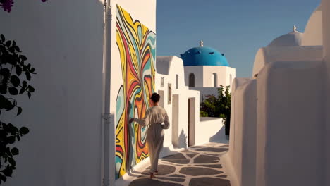 woman walking on santorini street