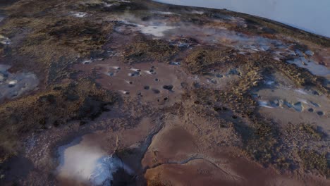 fumaroles emit steam in geothermal area in reykjanes peninsula, iceland