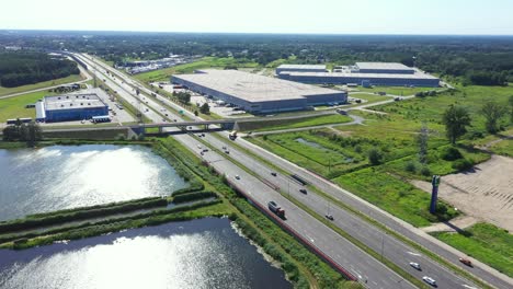 aerial top view of the large logistics park with warehouse, loading hub with many semi-trailers trucks