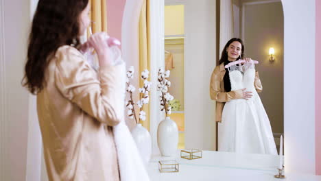 caucasian woman in wedding dress shop