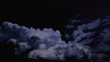 time-lapse off a night sky with clouds moving fast before the night sky